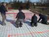 Placing the in-floor heating tubing.